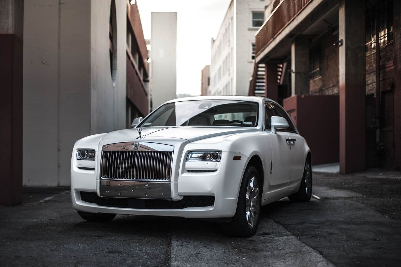 White luxury sedan with chrome grille for VIP and wedding transfers